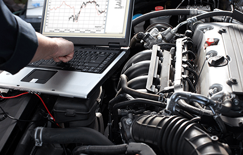 Image of a man servicing a vehicle